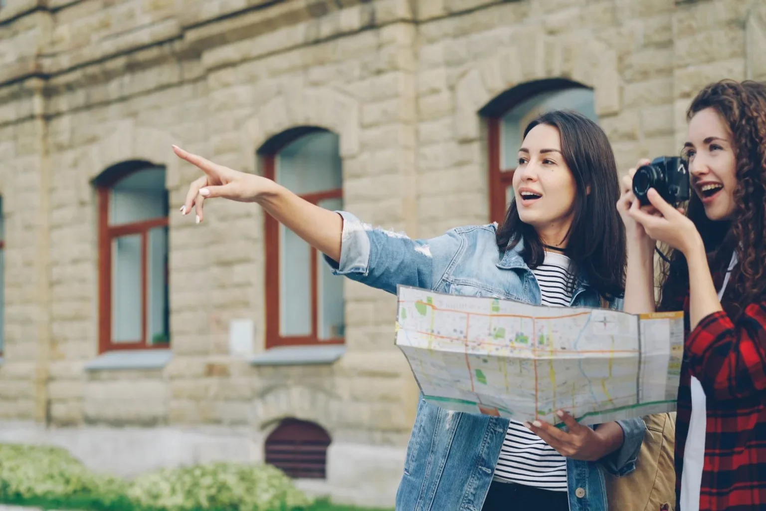 Travellers comparing a map with their surroundings