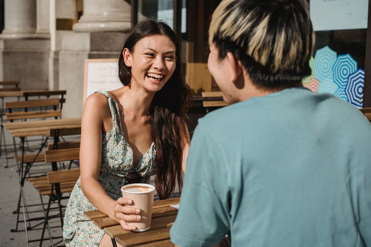 A group of friends sharing a conversation at a table