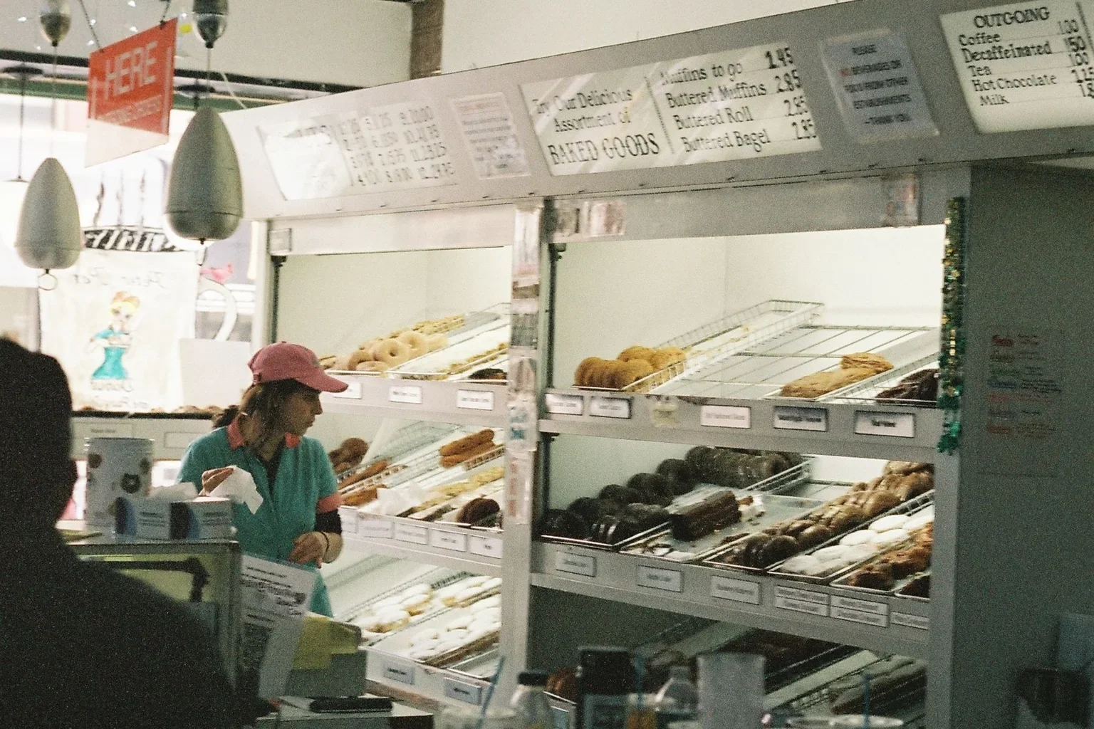 A customer choosing from a bakery display