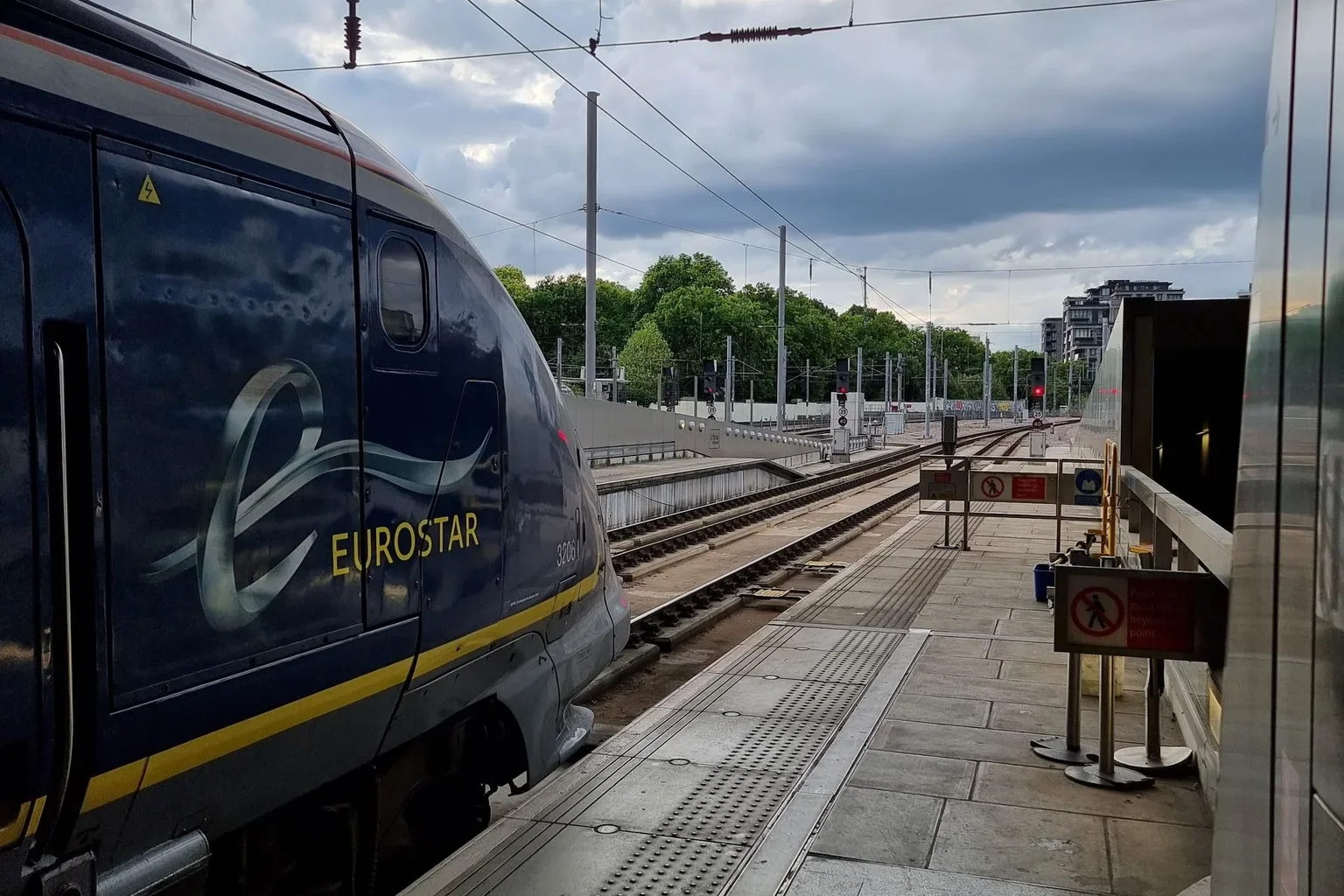 A train alongside a station platform in Paris