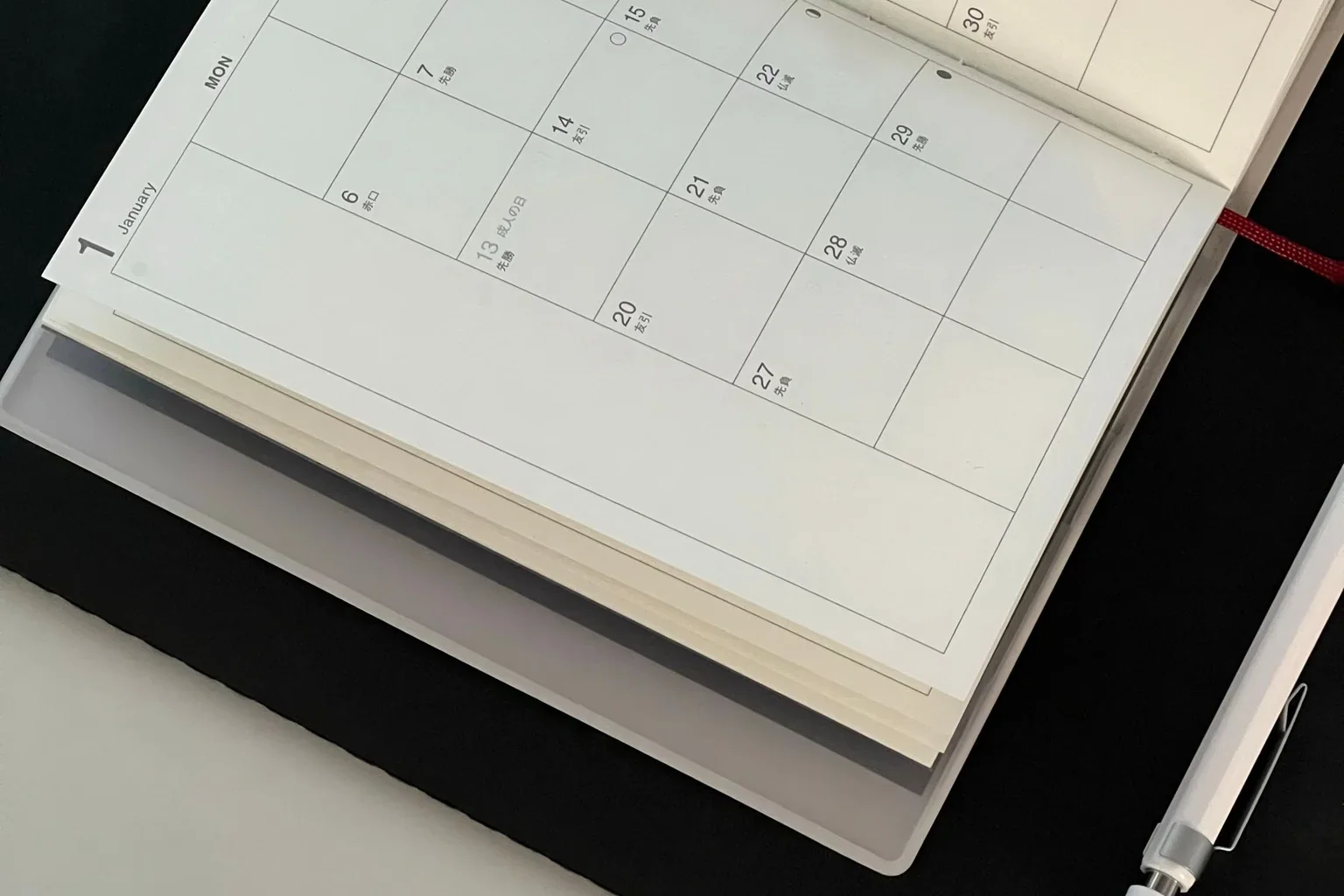 An open calendar and pen ready for an appointment